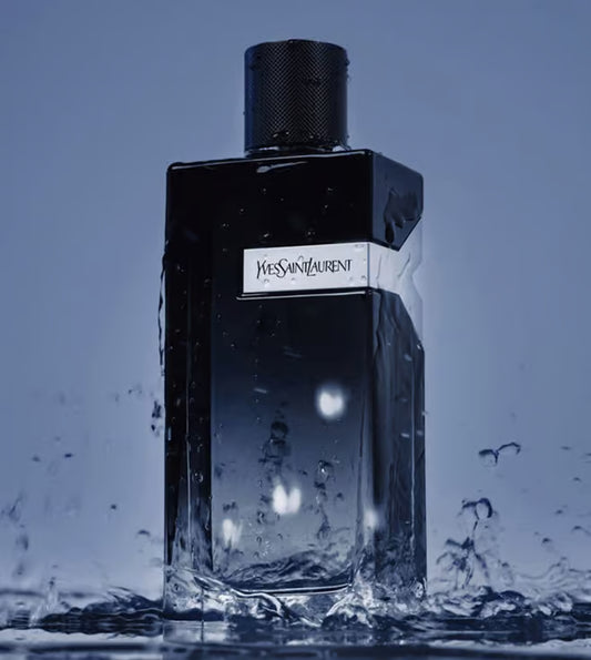Yves Saint Laurent perfume bottle with water droplets on a blue background Yves Saint Laurent Y Eau de Parfum 100 ml (3.3 fl.oz)