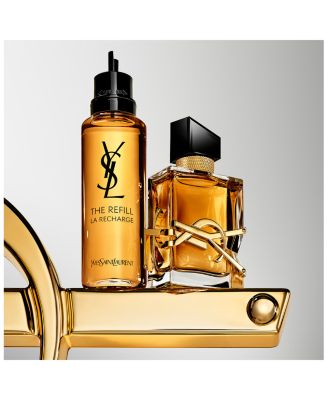 Two YSL perfume bottles on a gold stand with a gray background Yves Saint Laurent Libre Eau de Parfum Intense 90 ml (3 fl.oz)