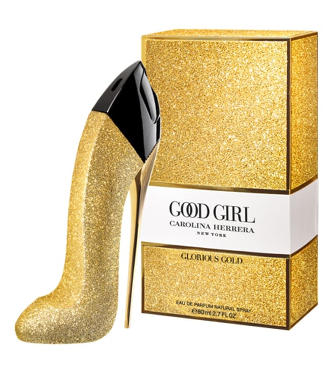 Gold high heel shoe and Carolina Herrera Good Girl Glorious Gold perfume box on a white background