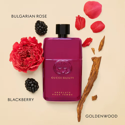 Gucci Guilty Absolute Pour Femme perfume bottle with floral and wood elements on a beige background Gucci Guilty Absolute Pour Femme Eau de Parfum 90 ml (3 fl.oz)