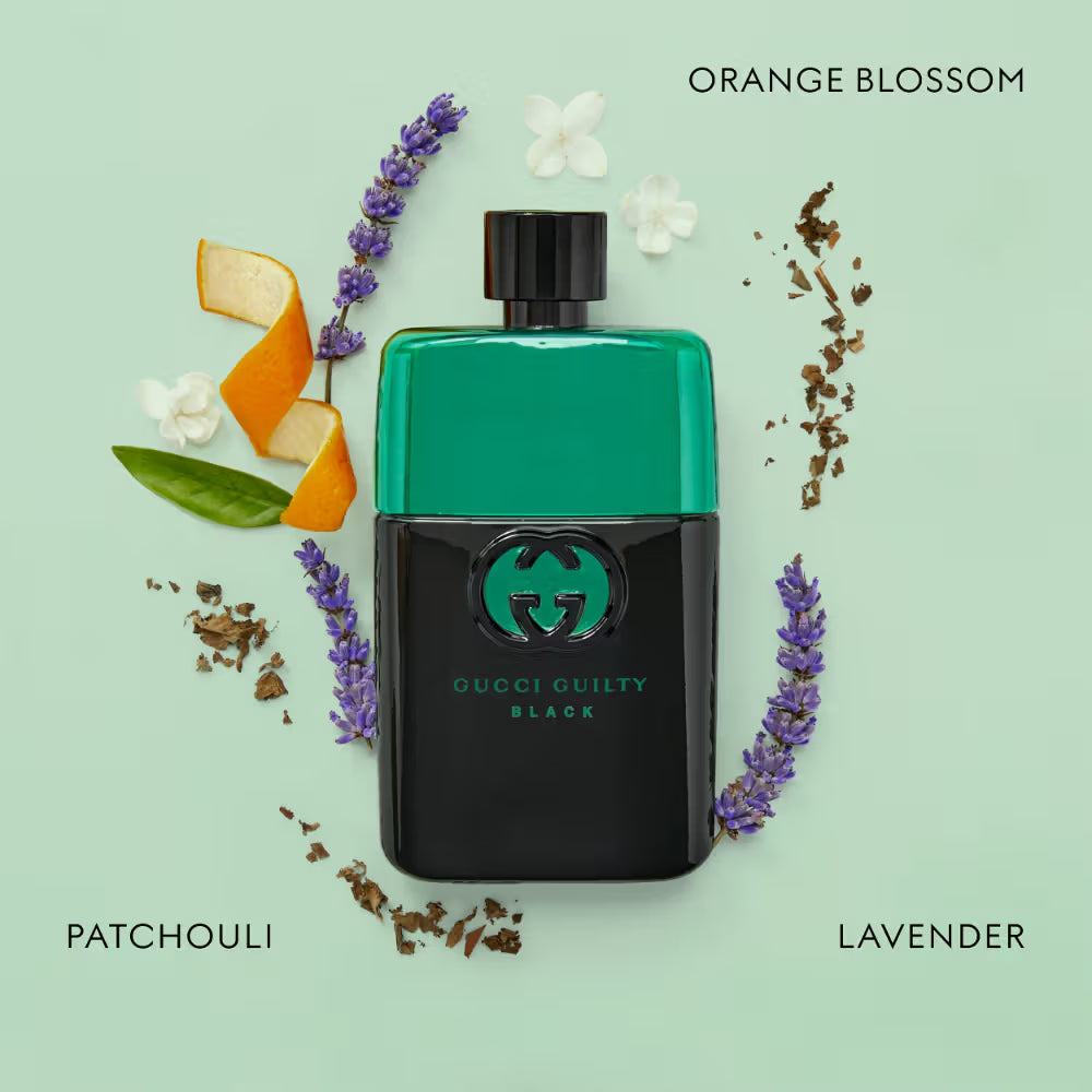 Gucci Guilty Black perfume bottle surrounded by flowers and herbs on a light green background Gucci Guilty Black Pour Homme Eau de Toilette 90 ml (3 fl.oz)