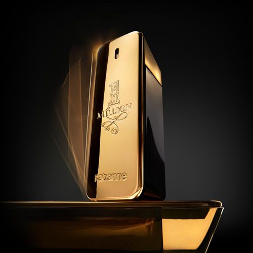 Gold perfume bottle with 'One Million' branding on a dark background