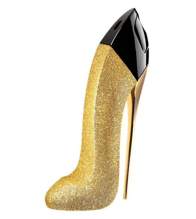 Gold glitter high heel shoe with black toe cap on a white background