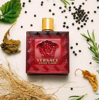 Versace Eros Flame perfume bottle on a white background with natural elements