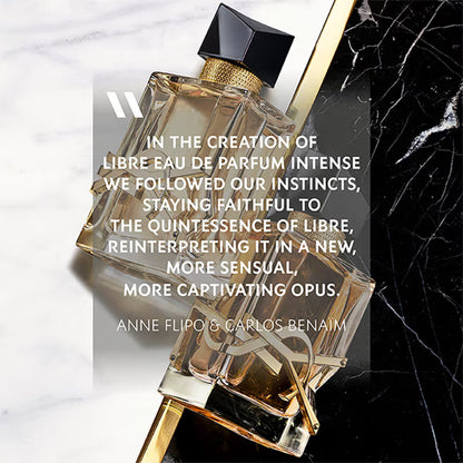 Perfume bottle with a quote on a marble surface Yves Saint Laurent Libre Eau de Parfum Intense 90 ml (3 fl.oz)