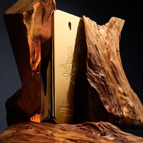 Gold perfume bottle with 'Ferragamo' branding on a wooden background Paco Rabbane 1 Million 100ml
