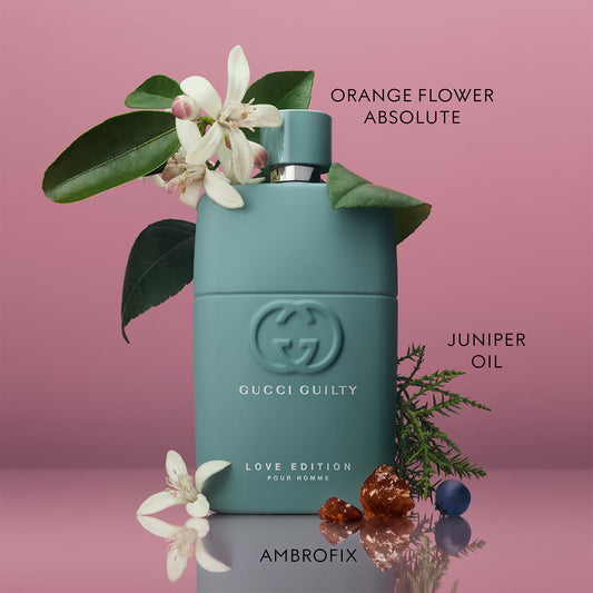 Gucci Guilty perfume bottle with orange flowers and juniper oil on a pink background Gucci Guilty Love Edition Pour Homme Eau de Parfum 90 ml (3 fl.oz)