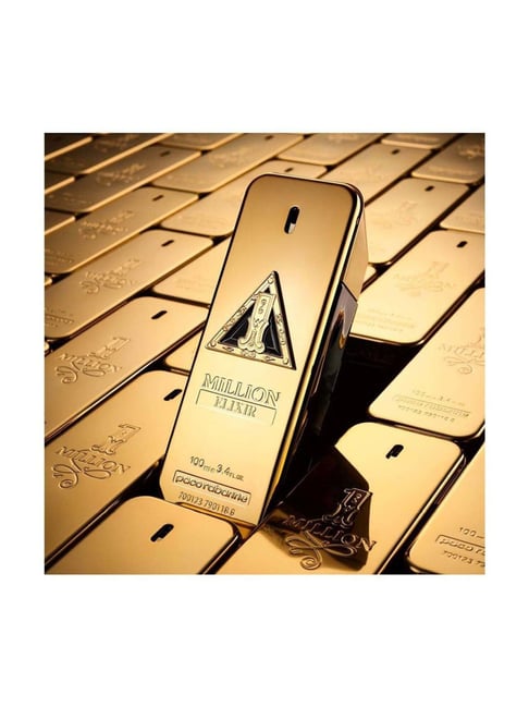 Gold bottle of Abercrombie & Fitch perfume on gold bars