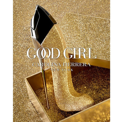 Carolina Herrera Good Girl perfume bottle on a glittery gold background