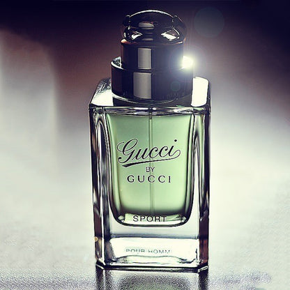 Gucci Sport perfume bottle on a reflective surface with a dark background Gucci by Gucci Sport Pour Homme Eau de Toilette 90 ml (3 fl.oz)
