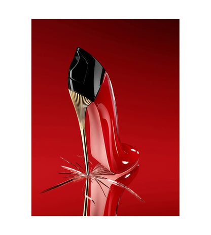 Red high-heeled shoe with black heel on a red background
