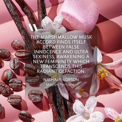 Floral and coffee bean arrangement with a quote by Nathalie Lorson on a pink background