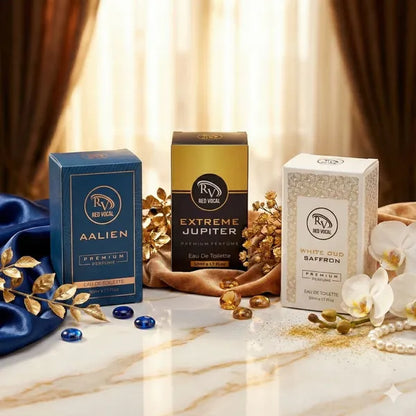 Three boxes of Red Vocal perfume on a marble surface with decorative elements. Red Vocal Aalien for Unisex , Extreme Jupiter for Women & White Oud Saffron Premium Perfume for Unisex Combo | Eau De Toilette | 3 x 50ml 