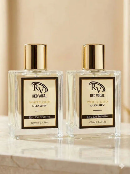 Two bottles of Red Vocal White Gold Luxury Eau De Toilette on a beige background  Red Vocal White Oud Luxury Premium Perfume Eau De Toilette – Unisex 100ml Bold & Long-Lasting Set of 2 Fragrance 