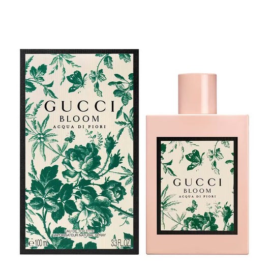 Gucci Bloom perfume bottle and packaging with floral design on a white background Gucci Bloom Acqua Di Fiori Eau de Toilette 100 ml (3.4 fl.oz)