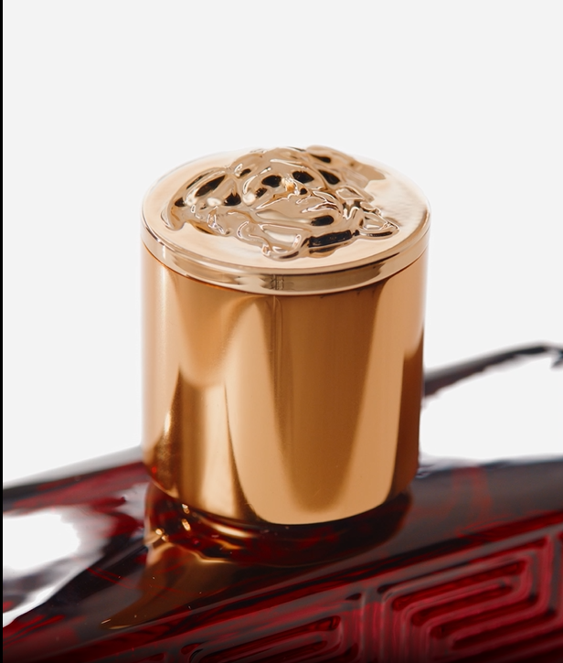 Bronze-colored metal object on a white background