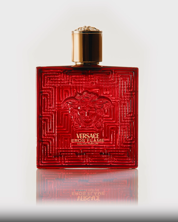 Red Versace perfume bottle on a white background