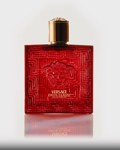 Red Versace perfume bottle on a white background