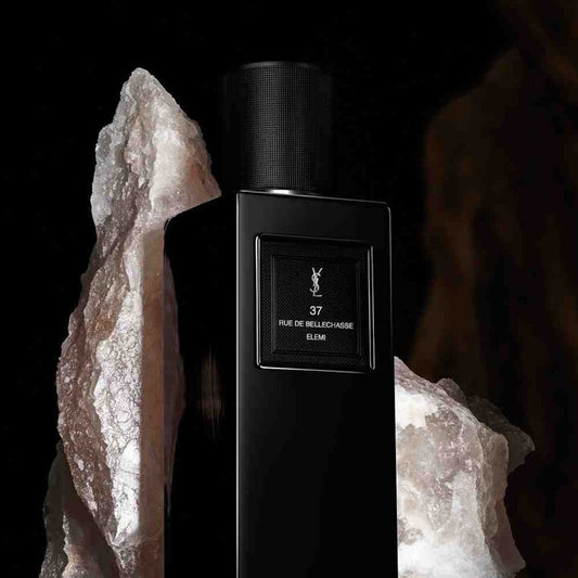 Black YSL perfume bottle with rock formation on a dark background Yves Saint Laurent 37 Rue de Bellechasse Elemi Eau de Parfum 100 ml (3.3 fl.oz)
