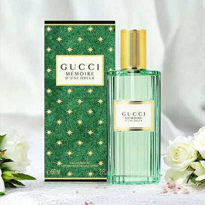 Gucci perfume bottle and packaging with white flowers on a light background Gucci Mémoire d'une Odeur Eau de Parfum 100 ml (3.4 fl.oz)