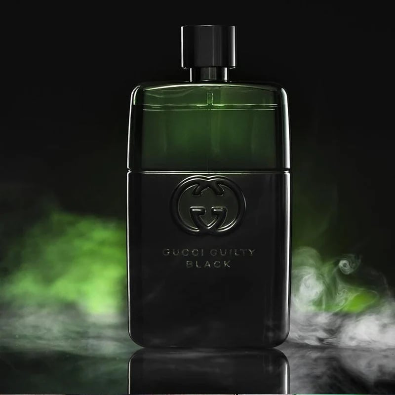 Gucci Guilty Black perfume bottle on a dark background with green smoke effects Gucci Guilty Black Pour Homme Eau de Toilette 90 ml (3 fl.oz)