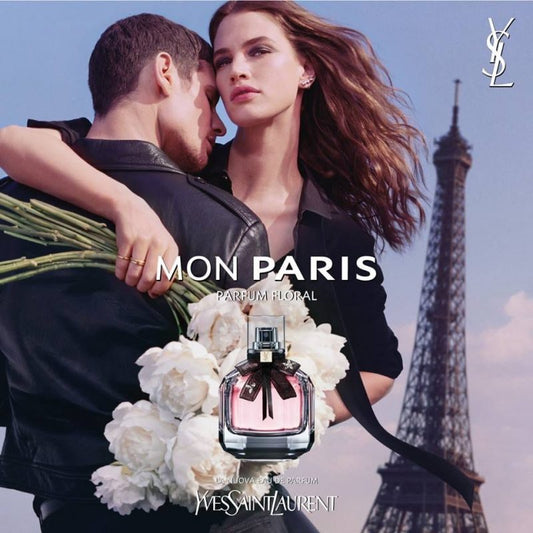 YSL Mon Paris perfume advertisement with a couple and the Eiffel Tower in the background Yves Saint Laurent Mon Paris Parfum Floral Eau de Parfum 90 ml (3 fl.oz)
